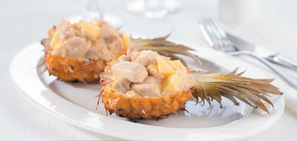 Pineapple stuffed with chicken fillet and cheese